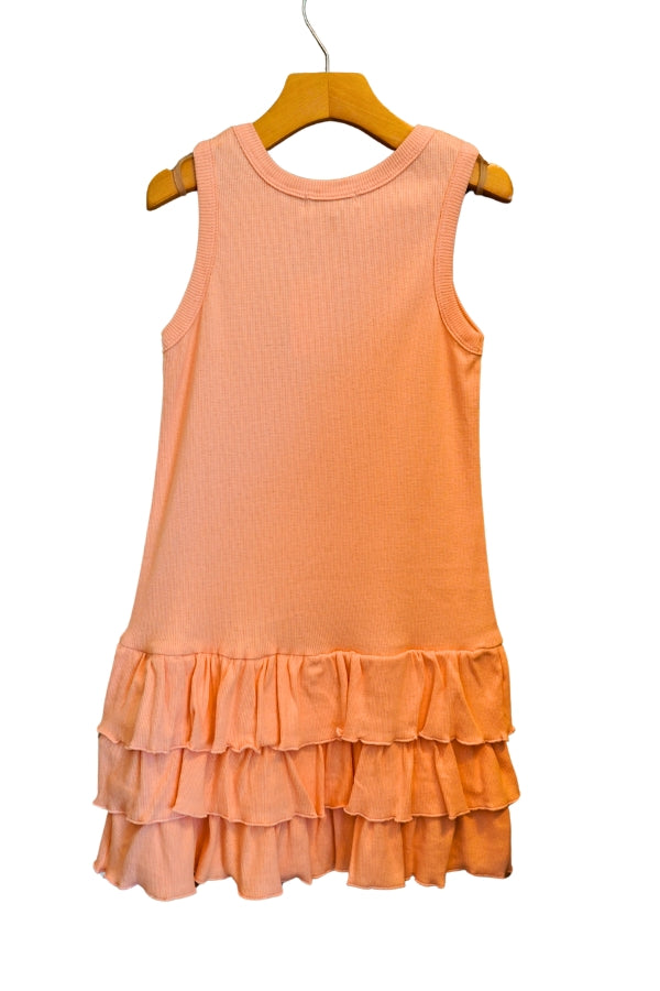 Peach-colored dress with ruffled layers on a hanger against a white background