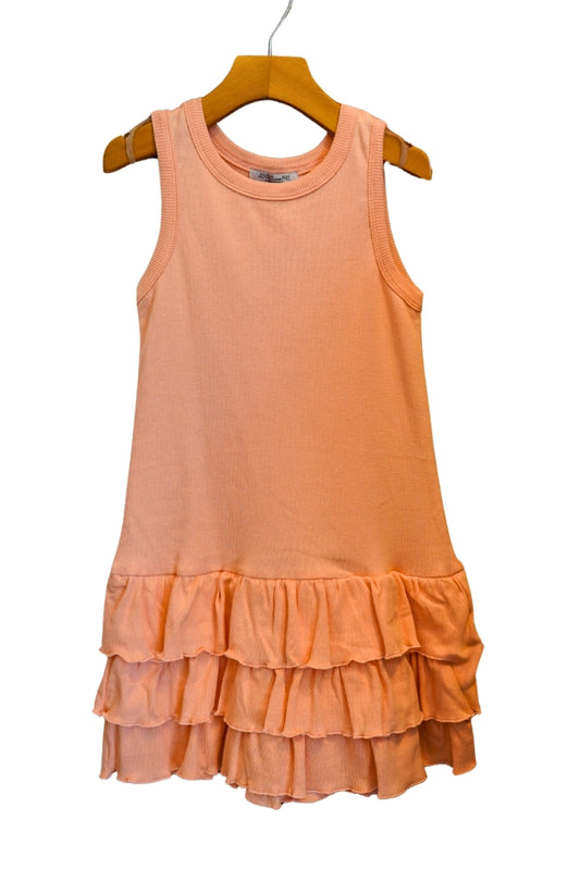 Peach-colored dress with ruffled skirt on a hanger against a white background