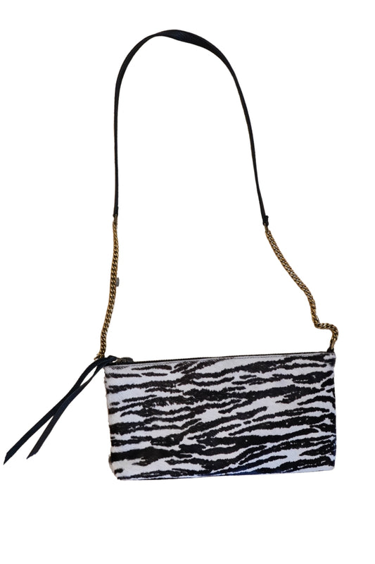 Zebra print handbag with a chain strap on a white background