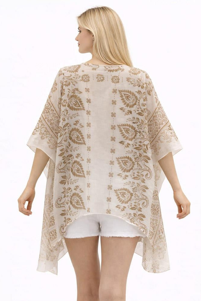 Paisley kimono back view in beige with gold paisley print, flowing wide sleeves