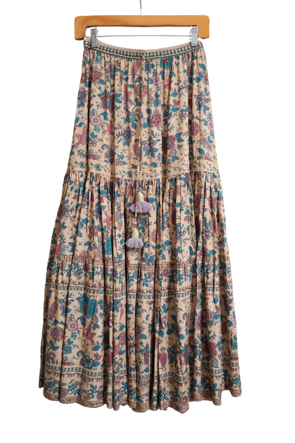 Floral tiered skirt on hanger with elastic waistband and gathered ruffle hem, blue base