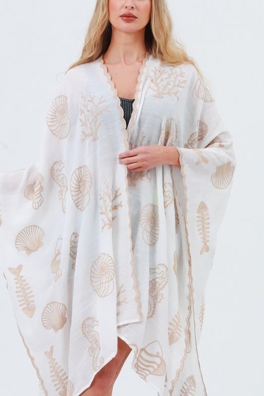 White kimono with shell and seahorse embroidery, open front, scalloped trim at edges