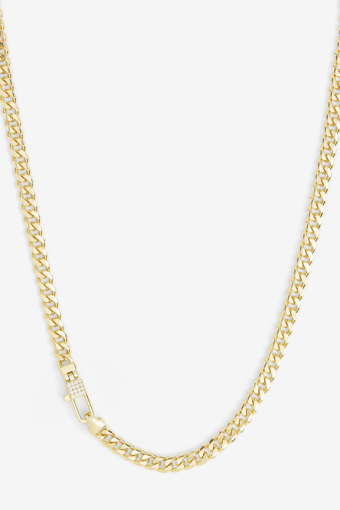 Gold-tone curb chain necklace with pavé lock detail at center