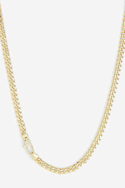Gold-tone curb chain necklace with pavé lock detail at center