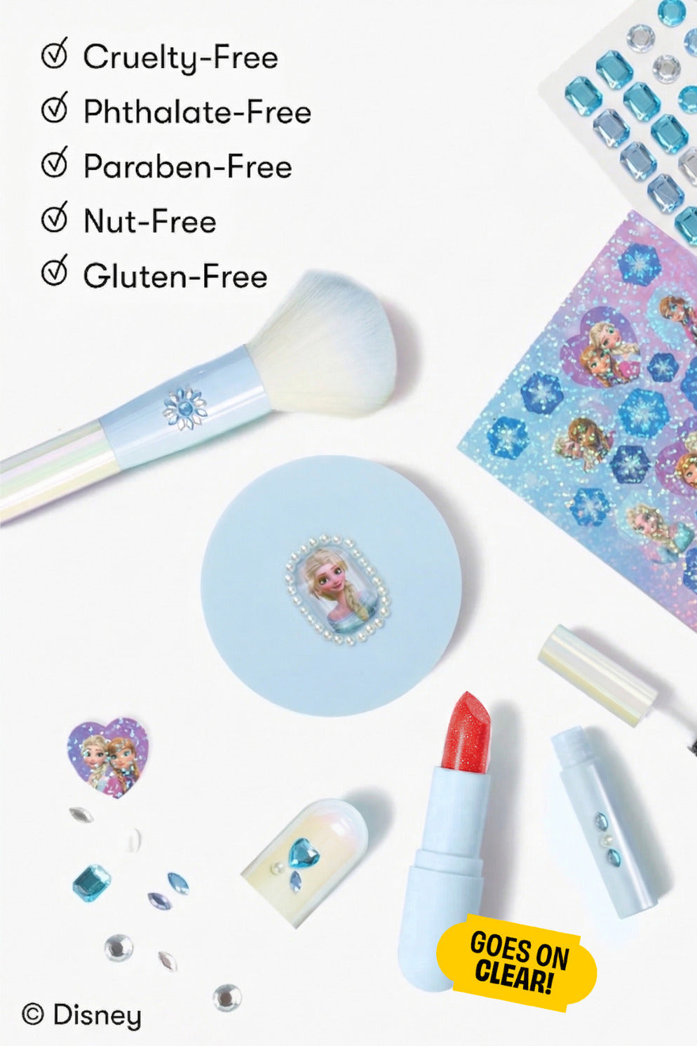 Frozen Elsa makeup kit with brush, lip color, and sponge accessories