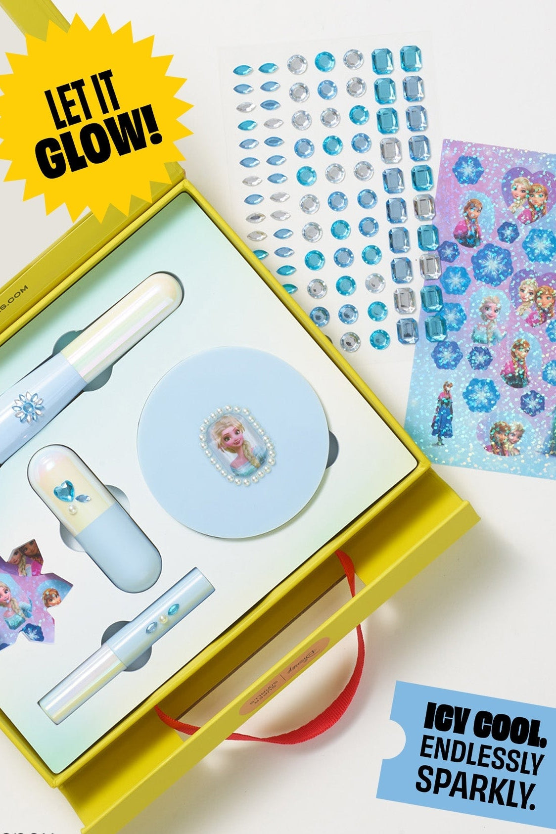Frozen Elsa makeup kit open with brush, lip balm, and glitter sticker sheet