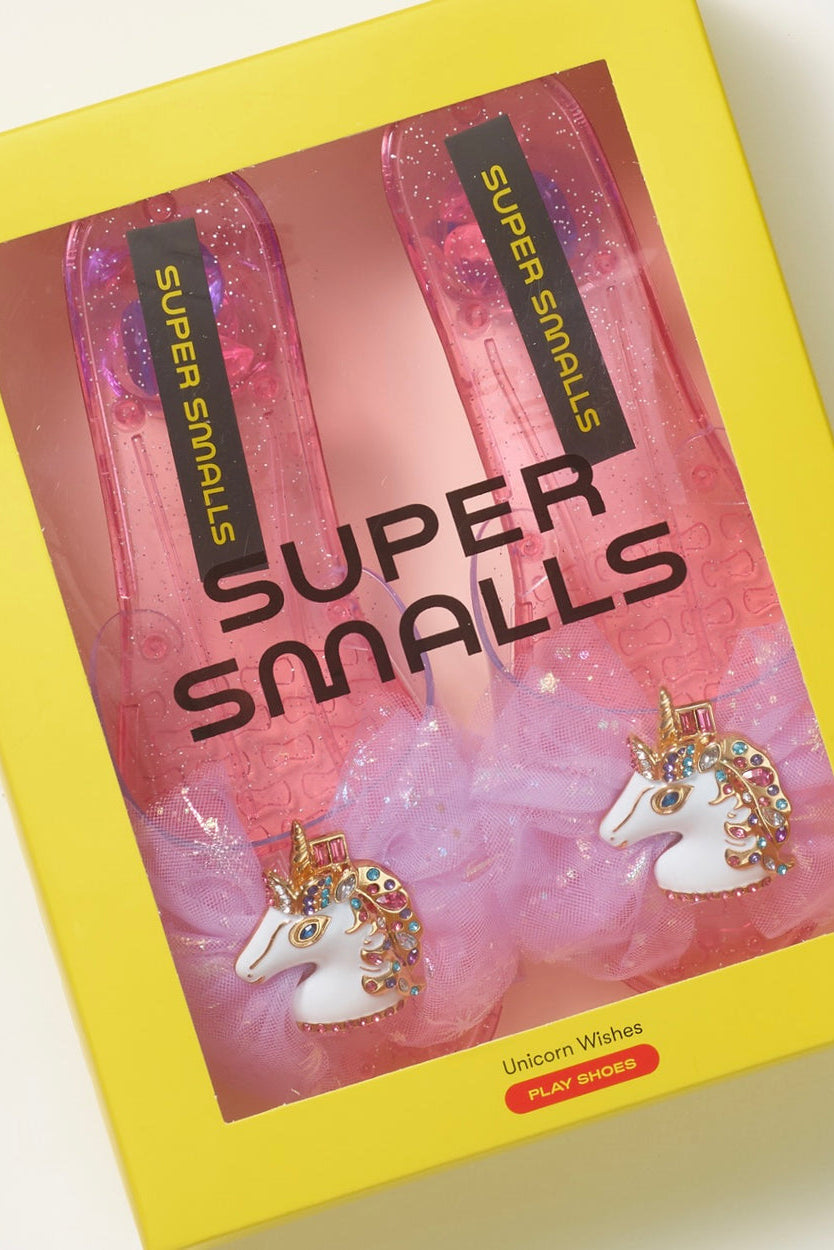 Pair of pink translucent unicorn play shoes in packaging, sparkly tulle bows