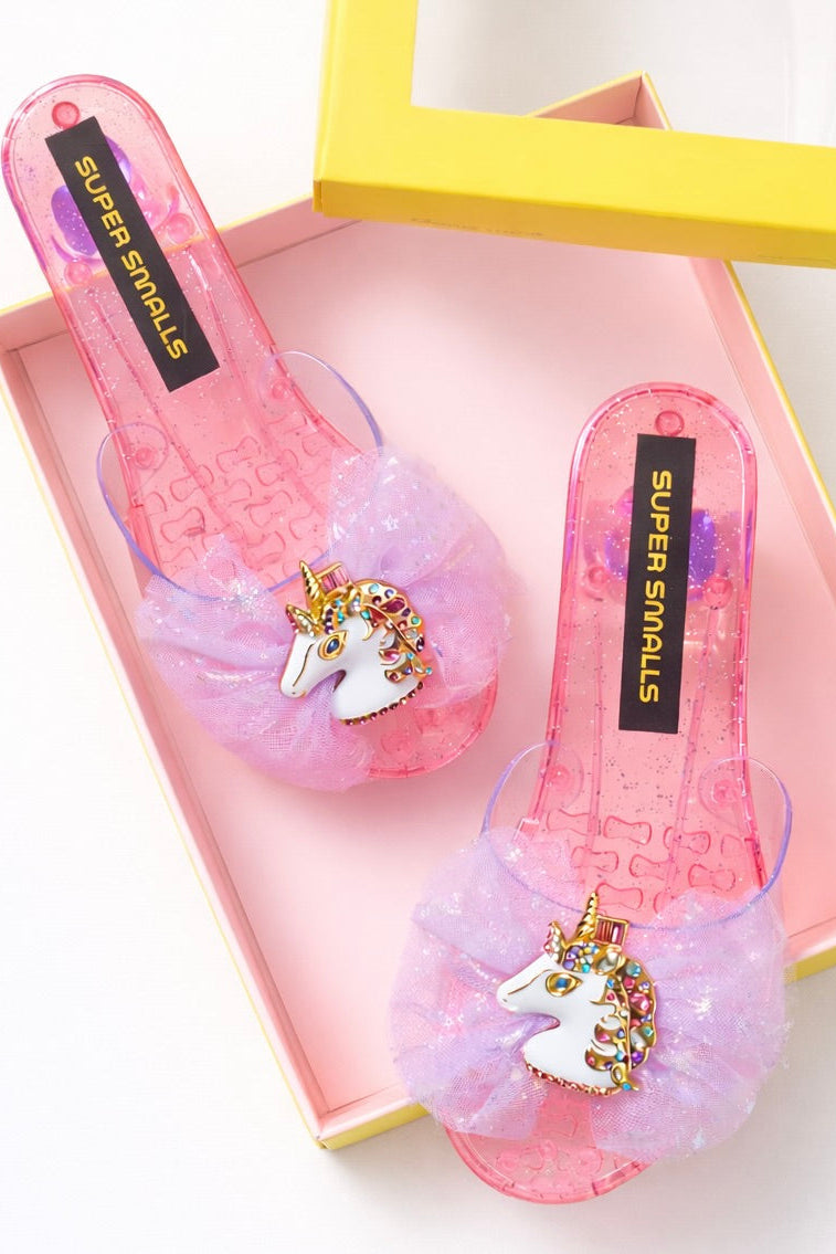 Pink translucent play shoes with unicorn applique, heart-pattern detail and glitter