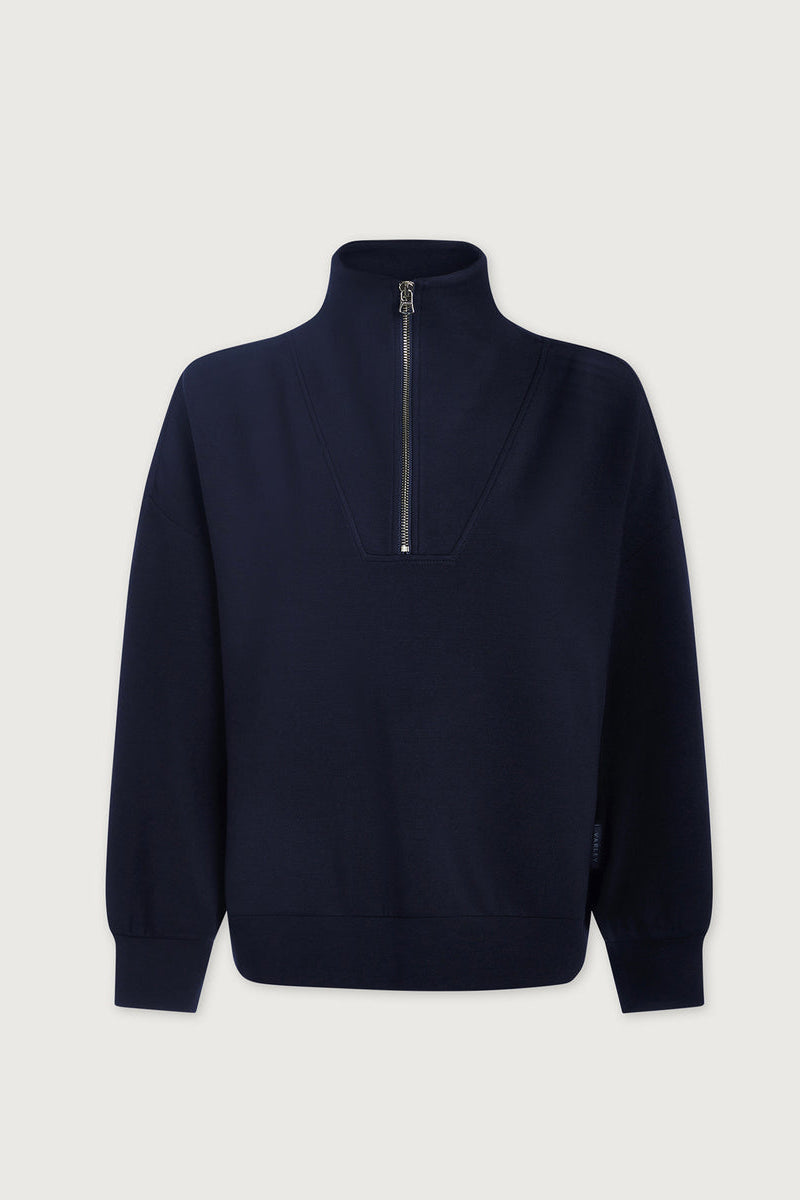 Navy half-zip pullover with stand collar and long sleeves, front zip detail