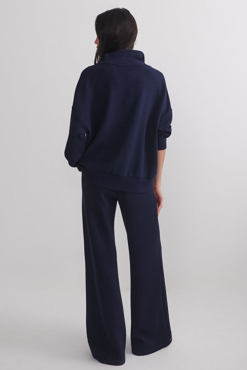Navy extra wide-leg pants shown from the back, full length wide legs