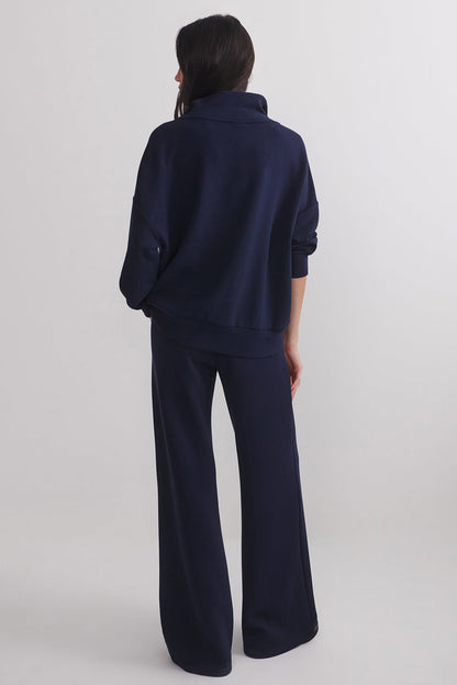 Navy extra wide-leg pants shown from the back, full length wide legs