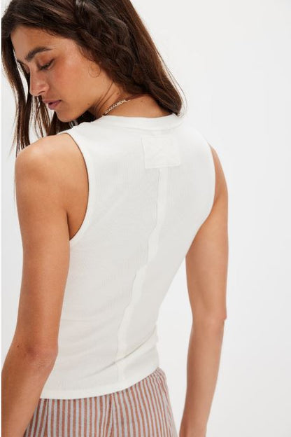 White ribbed henley tank top, back view with center seam and pocket flap.