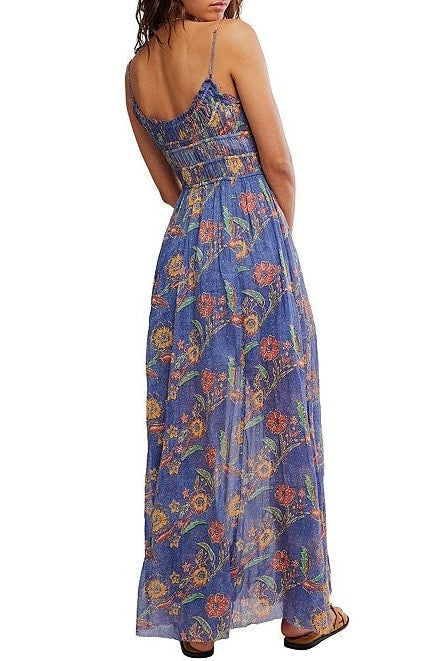 Woman wearing a blue floral dress on a white background