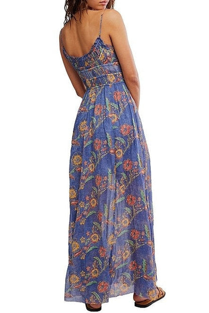 Woman wearing a blue floral dress on a white background