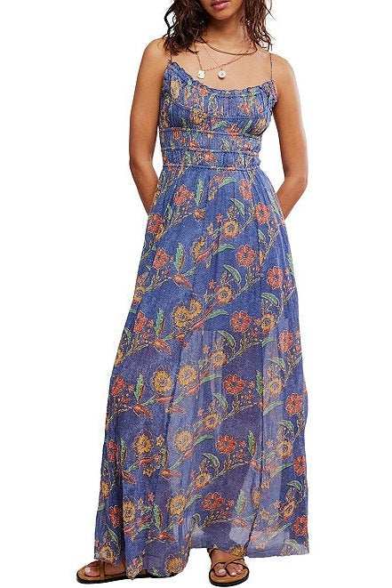 Woman wearing a blue floral dress on a white background