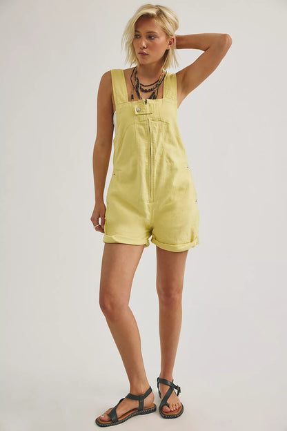 Sleeveless yellow shortall with front zipper and bib pocket front