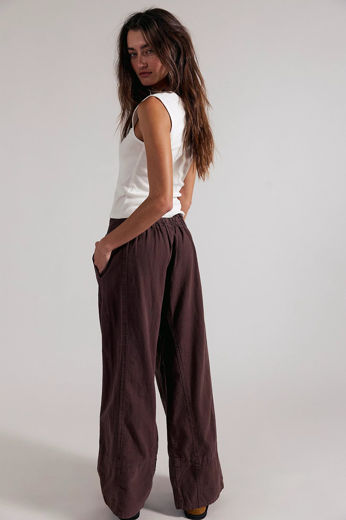 Dark brown linen pull-on pants with gathered elastic waist and wide straight legs