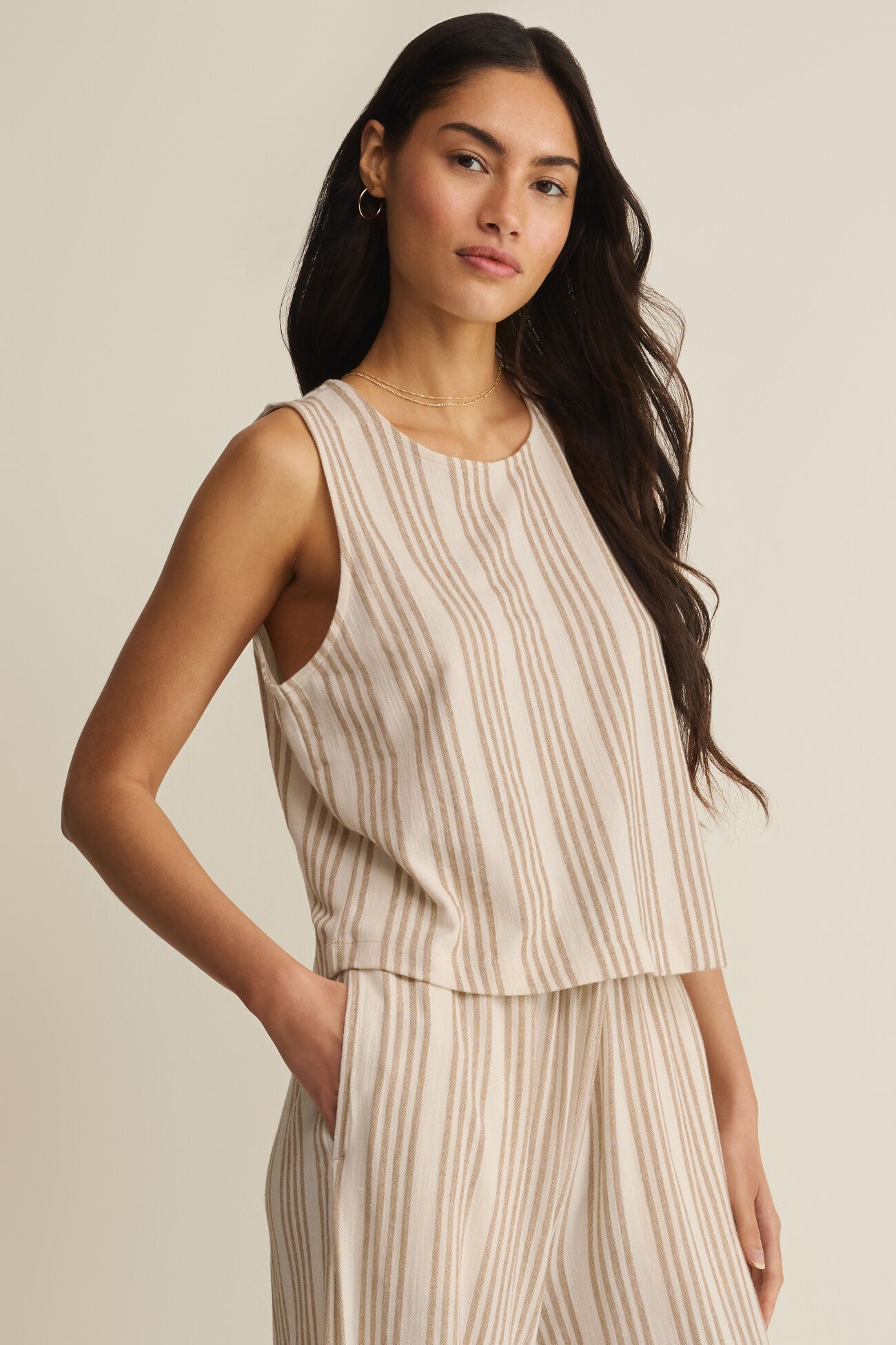 Sleeveless striped knit top with crew neck and straight hem, light beige with tan stripes
