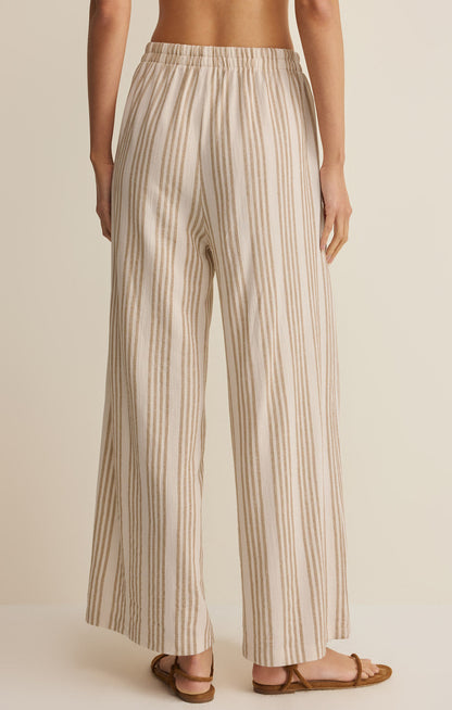 Striped knit pants with elastic waist and wide legs, tan vertical stripes on light fabric