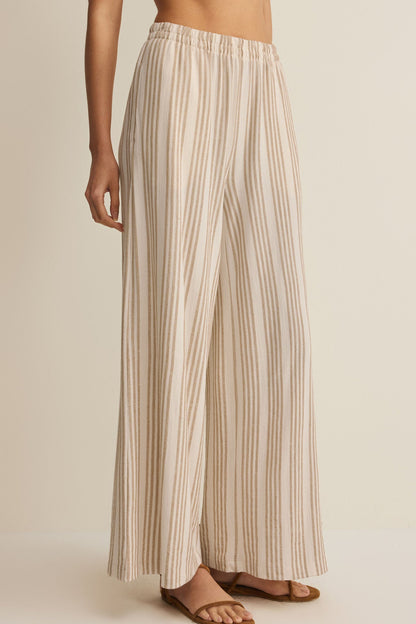 Striped knit wide-leg pants with elastic waistband, tan vertical stripes on light fabric