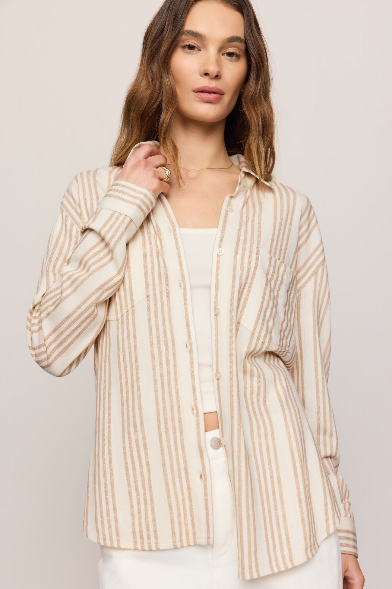 Striped button-up shirt with collar, long sleeves, and button front