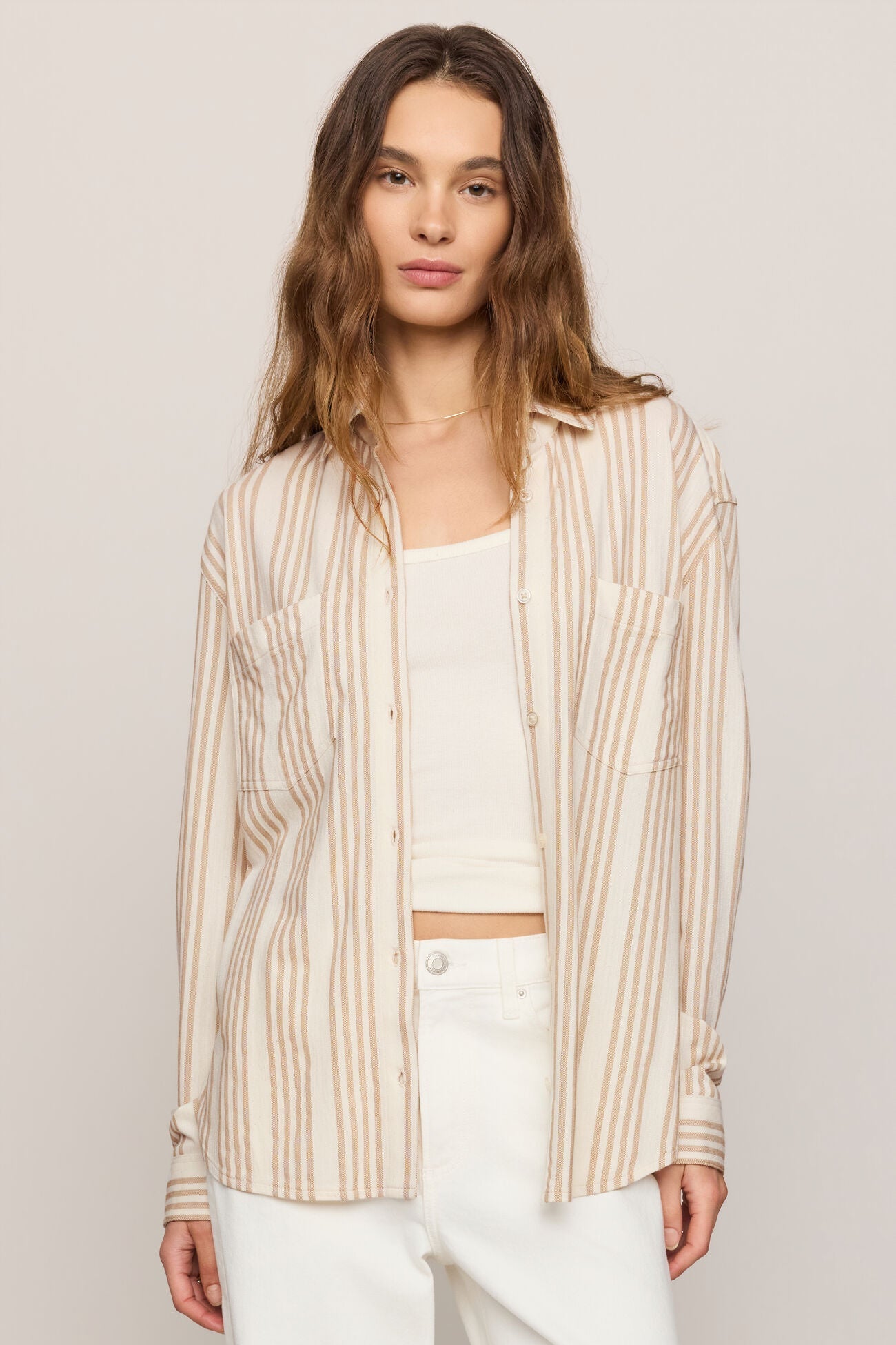Striped button-up shirt with chest patch pockets, collar, and button front