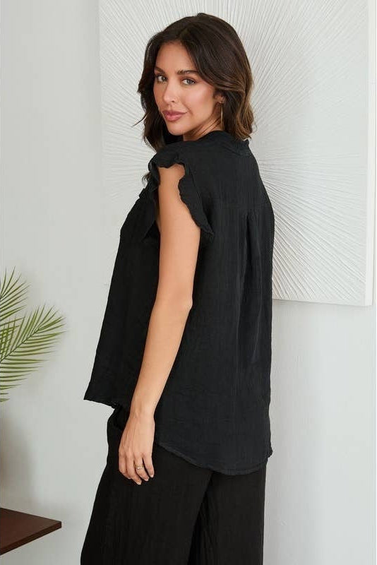 Black linen ruffle button-down short-sleeve top, side profile view