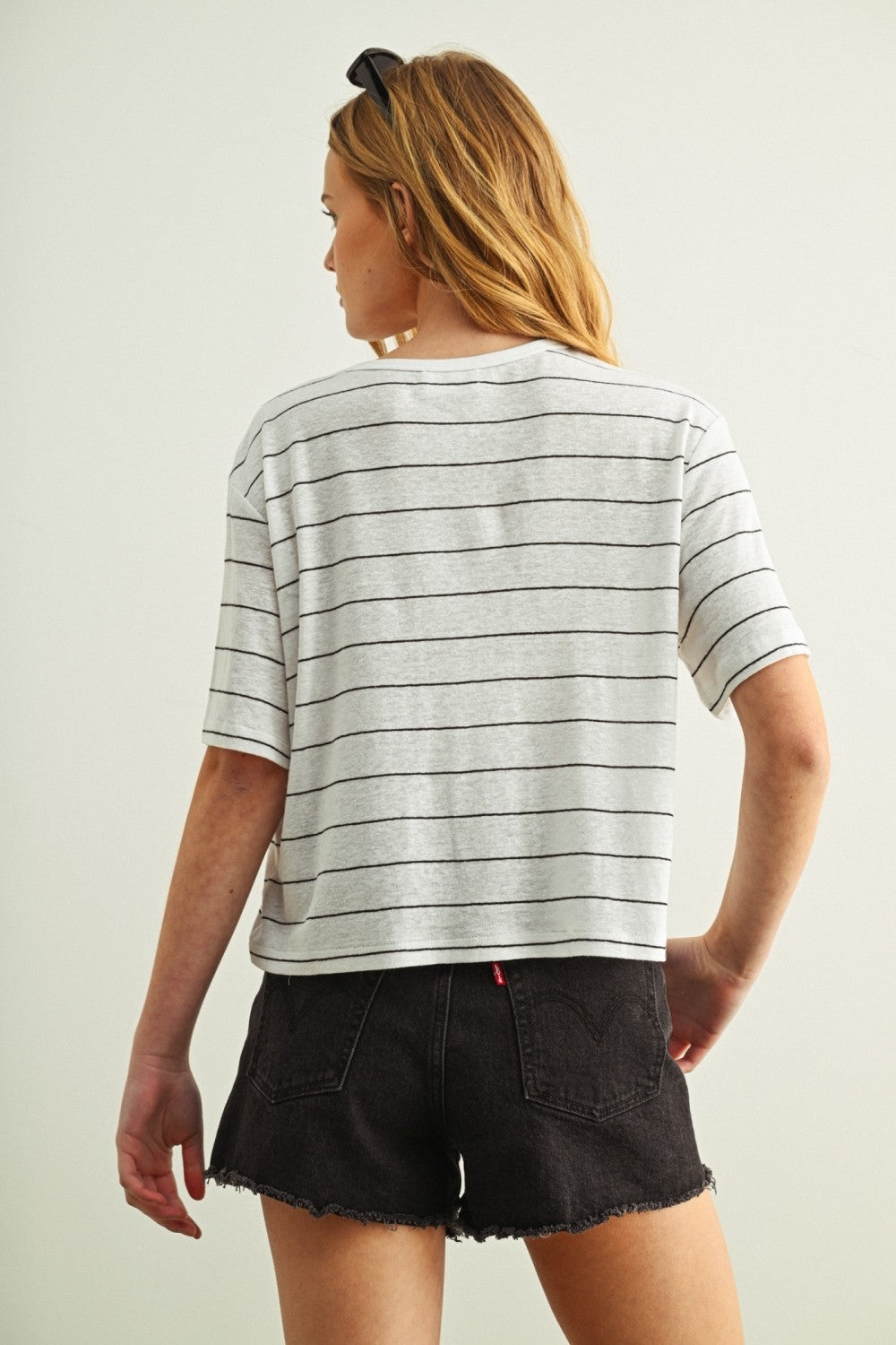Striped linen top in light gray/black with horizontal stripes, back view, short sleeves