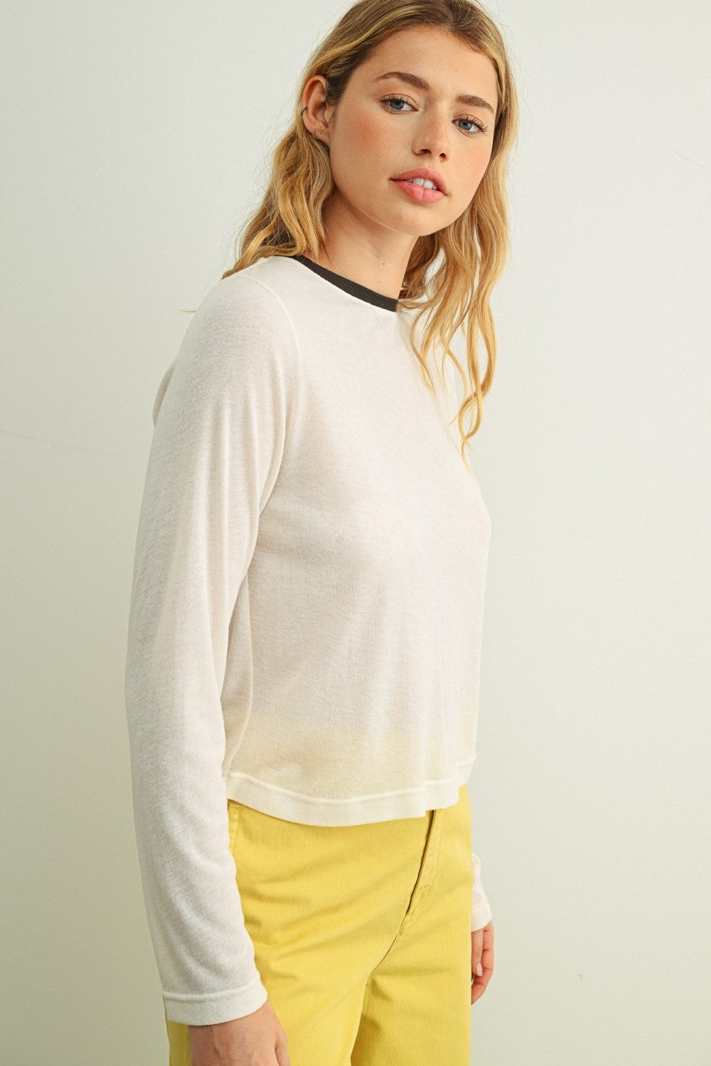 Cream ringer long-sleeve top with contrast navy collar trim, front side view