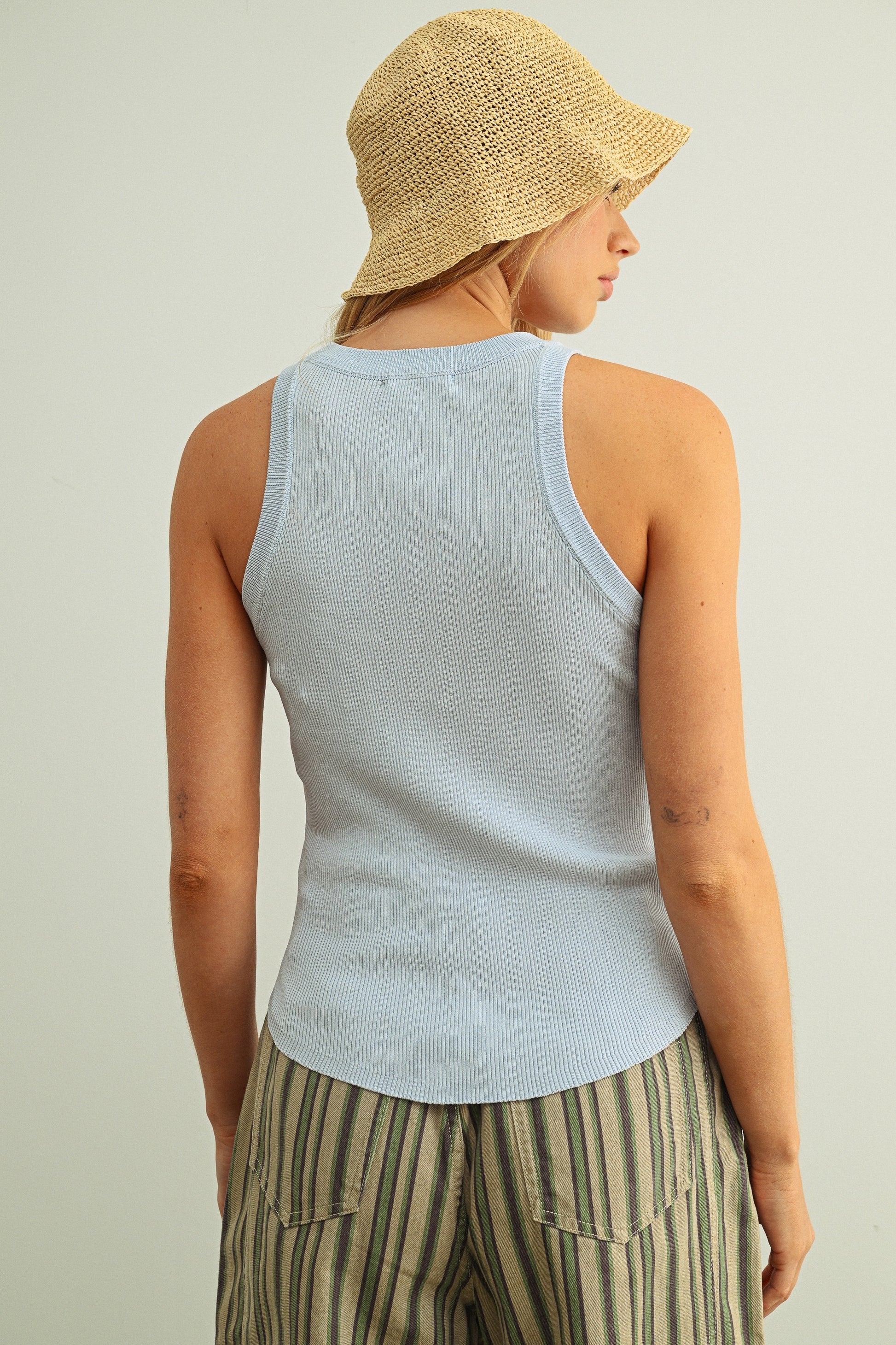 Light blue ribbed tank top back view, sleeveless fitted ribbed knit crew neck.