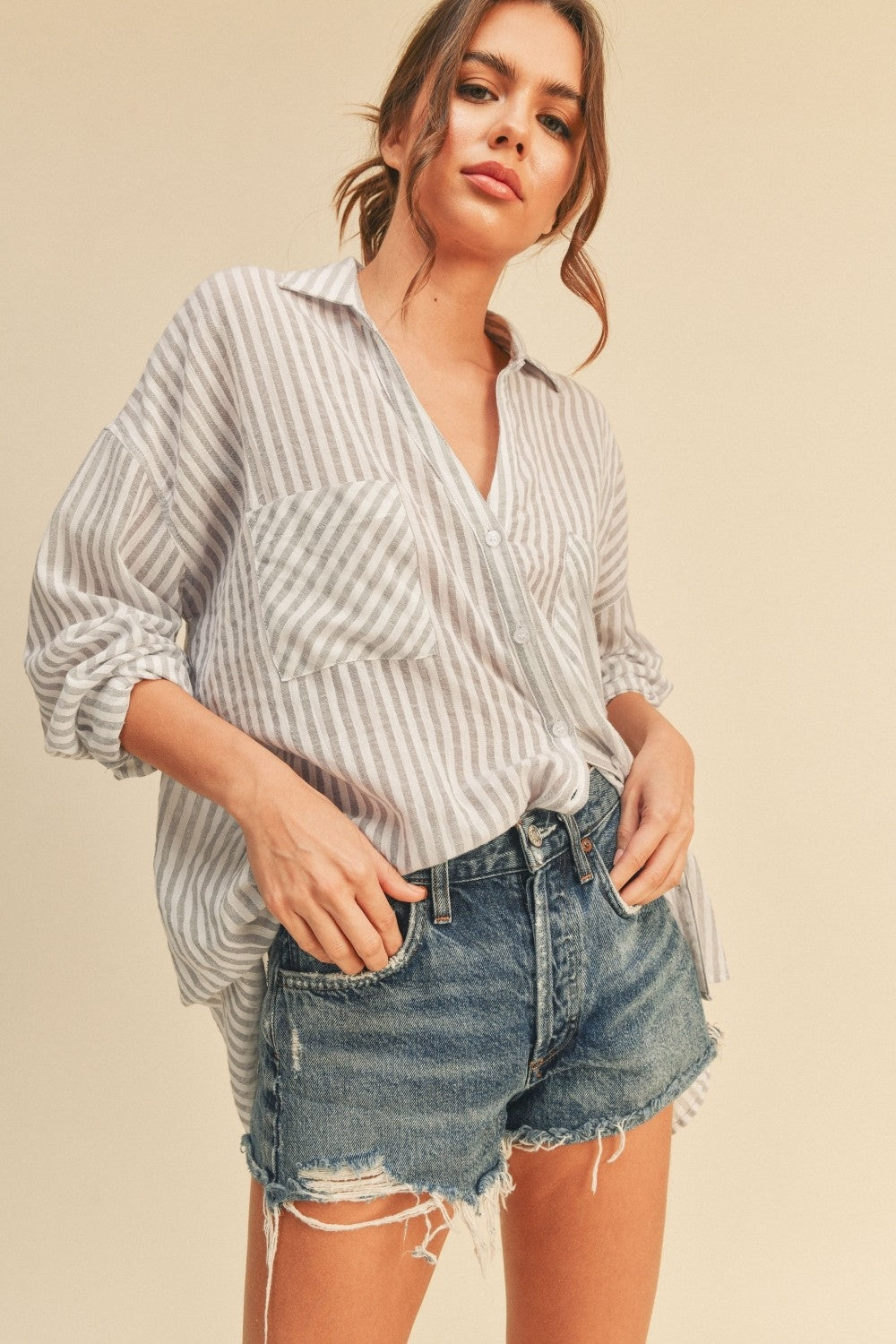 Grey striped button-down shirt with collar, button front, and long cuffed sleeves