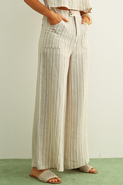 Linen wide-leg pants with front button and patch pockets, vertical stone stripes