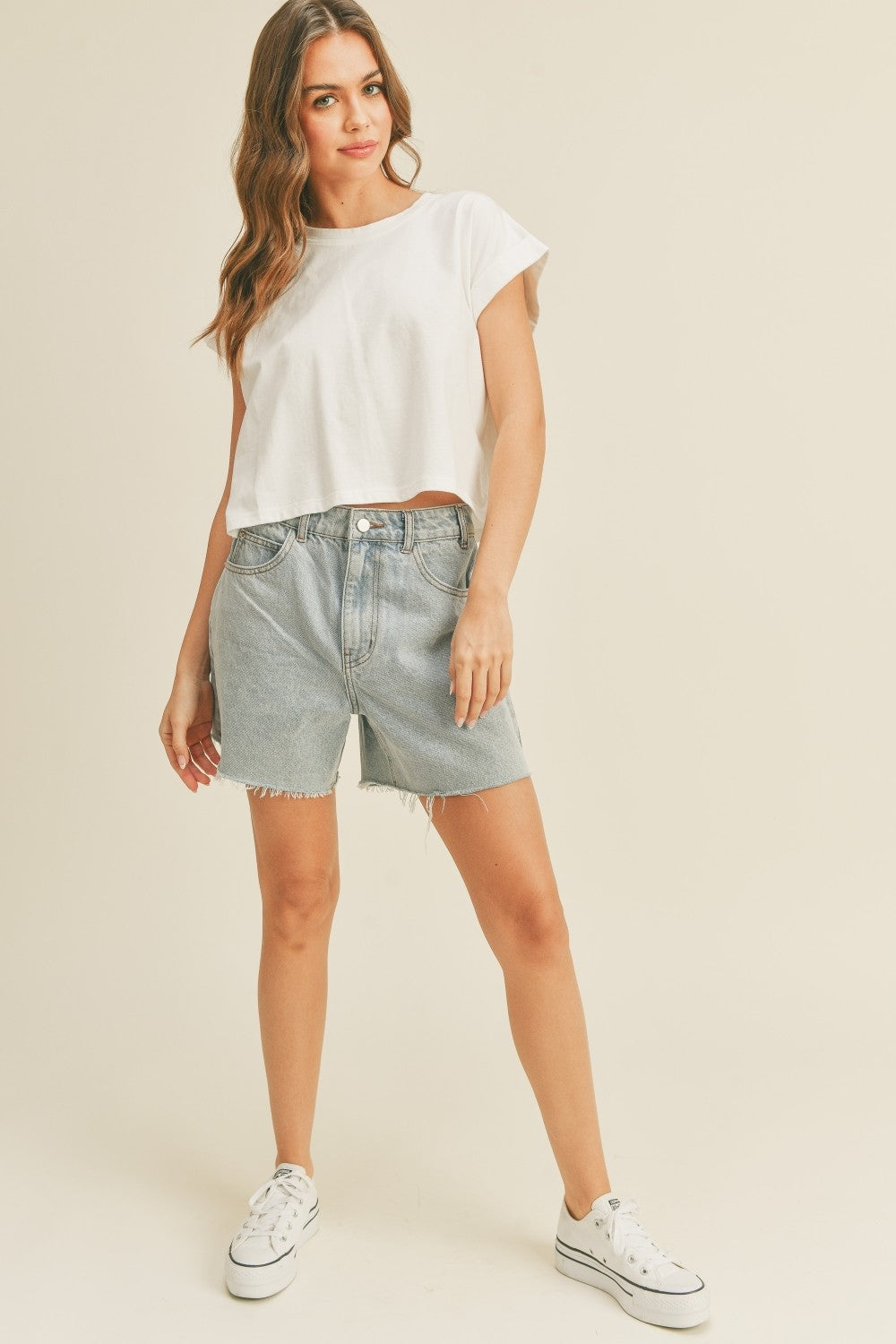 Off-white round neck cuff sleeve top with short sleeves and straight hem