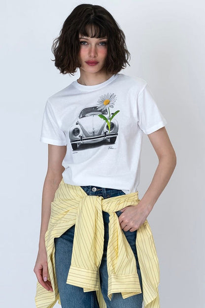 White graphic T-shirt with car illustration and daisy flower on front