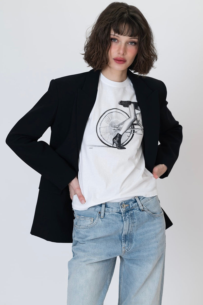 Worn white crew-neck graphic t-shirt with cyclist bicycle wheel graphic