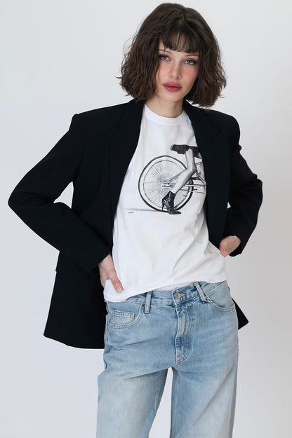 Worn white crew-neck graphic t-shirt with cyclist bicycle wheel graphic