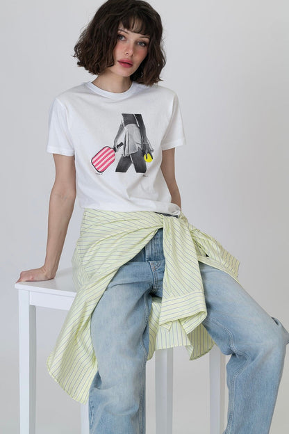 White graphic T-shirt with black-and-gray figure print, red striped heart, and yellow accent