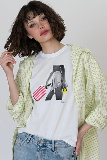 White graphic T-shirt with black-and-gray figure, red striped heart, and yellow detail