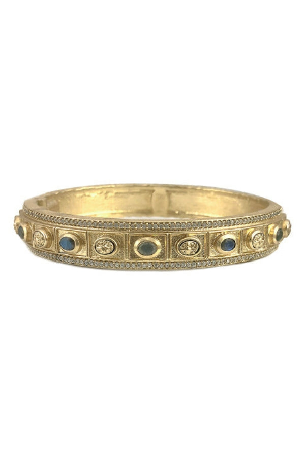 Gold oval coin bangle with blue inlaid stones and textured edge detail