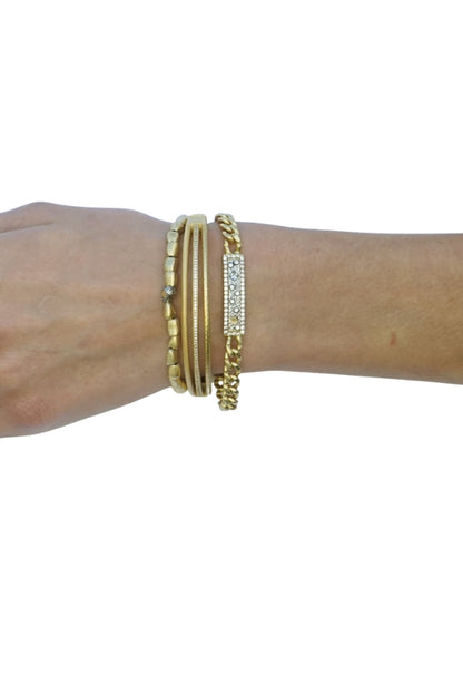 LUMIERE pavé bangle on wrist with multiple gold bands and pavé sparkle row