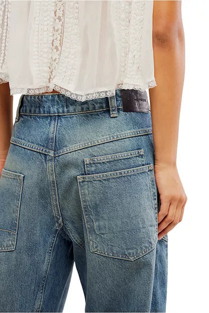 Light blue denim jeans with rear yoke seam and patch back pockets