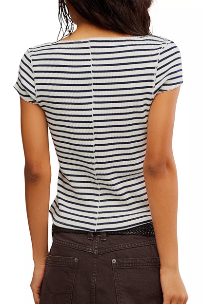 Person wearing a black and white striped shirt on a white background