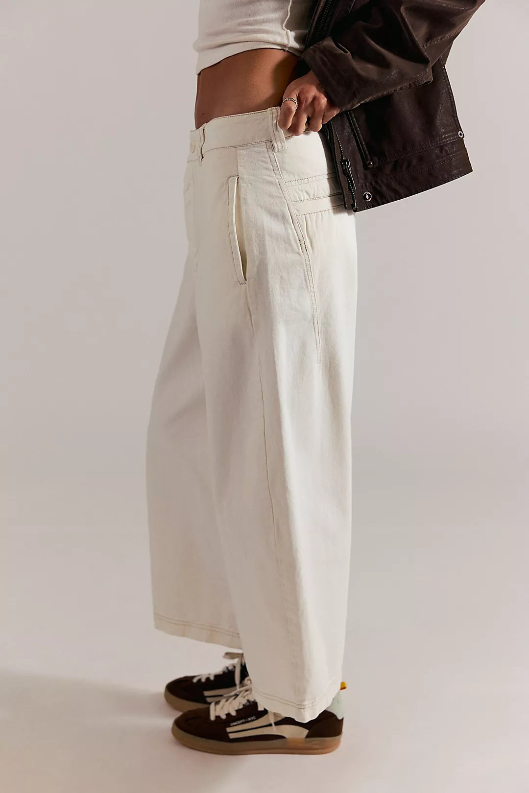 Laydown chino pants in clean ivory, side view with front side pocket and stitched seams