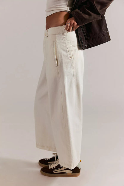 Laydown chino pants in clean ivory, side view with front side pocket and stitched seams