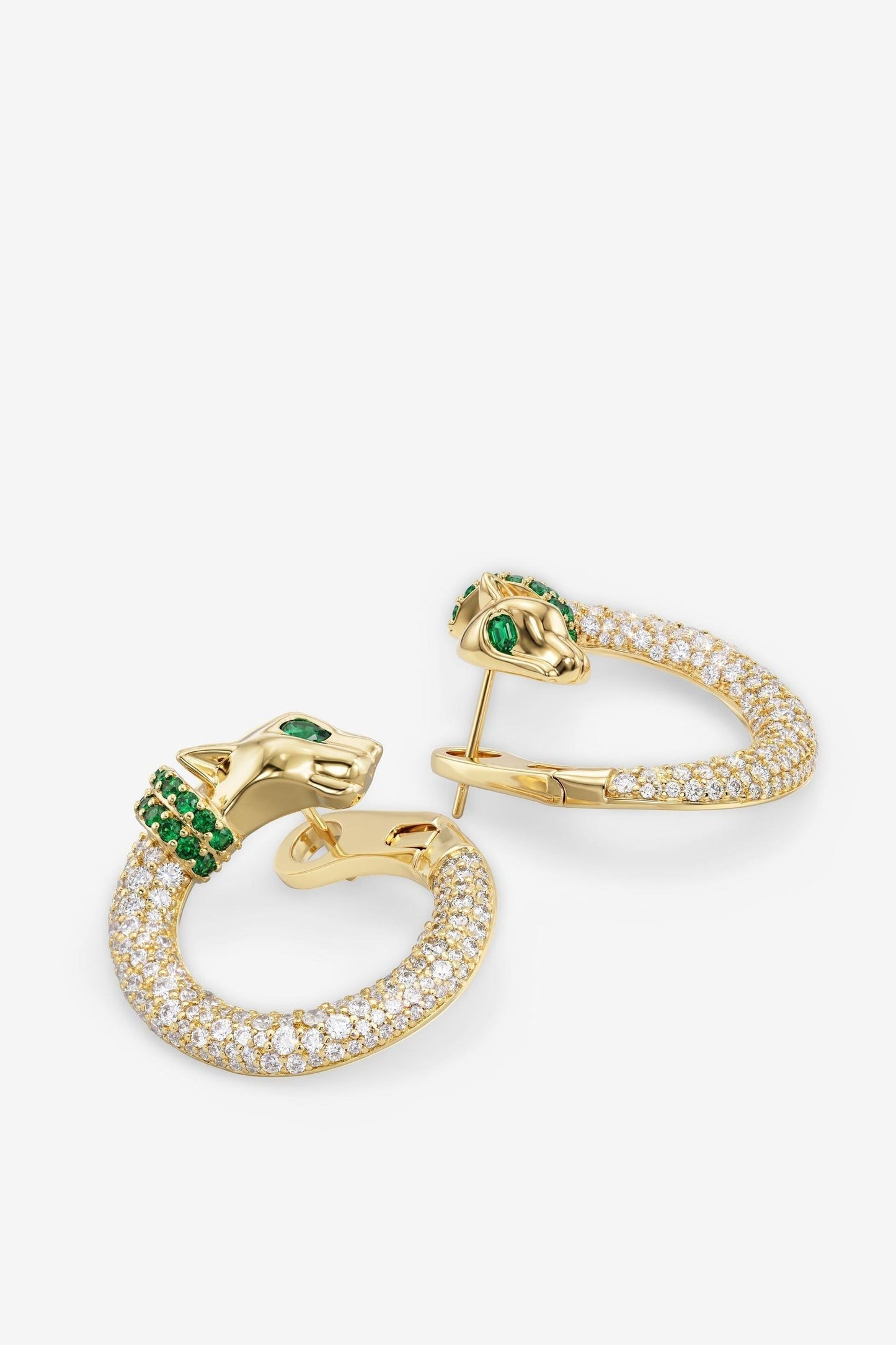Gold-tone hoop earrings with clear pavé stones and green center gem details.