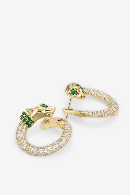 Gold-tone hoop earrings with clear pavé stones and green center gem details.