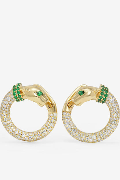 Gold-tone hoop earrings with clear pavé stones and green gem accent clusters.