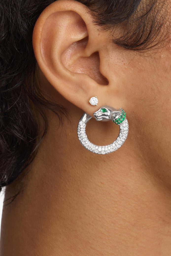 Silver-tone hoop earring with clear pavé ring and green gem and stud accents.