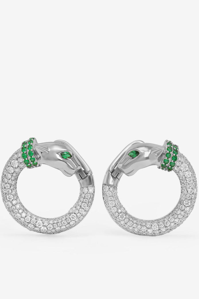 Silver-tone hoop earrings with clear pavé stones and green gem accent clusters.