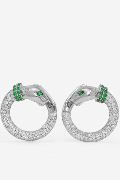 Silver-tone hoop earrings with clear pavé stones and green gem accent clusters.
